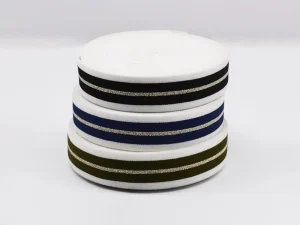 Stacked wholesale elastic band rolls with metallic stripe design for bulk purchase